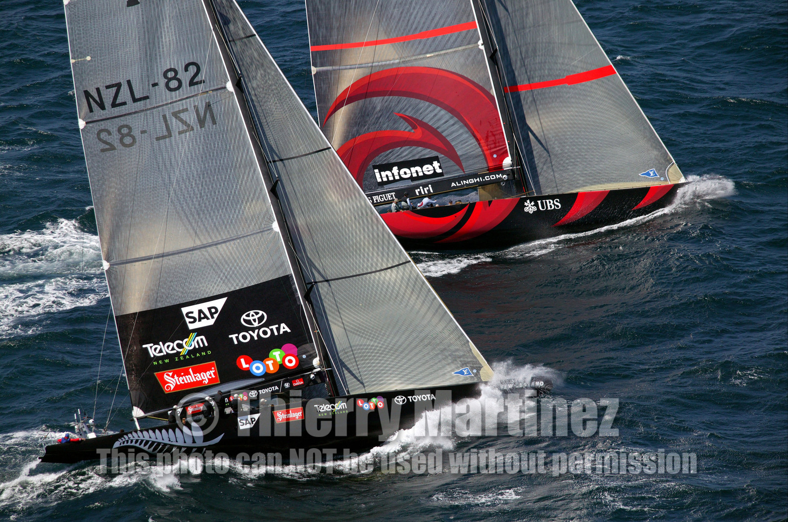 03_0899D © Th.Martinez. Auckland   New Zealand. 15 02 03 America's Cup Day 1.Alinghi (SUI64) vs Team New Zealand (NZL82) SUI64 leading on NZL82 before they broke the boom.