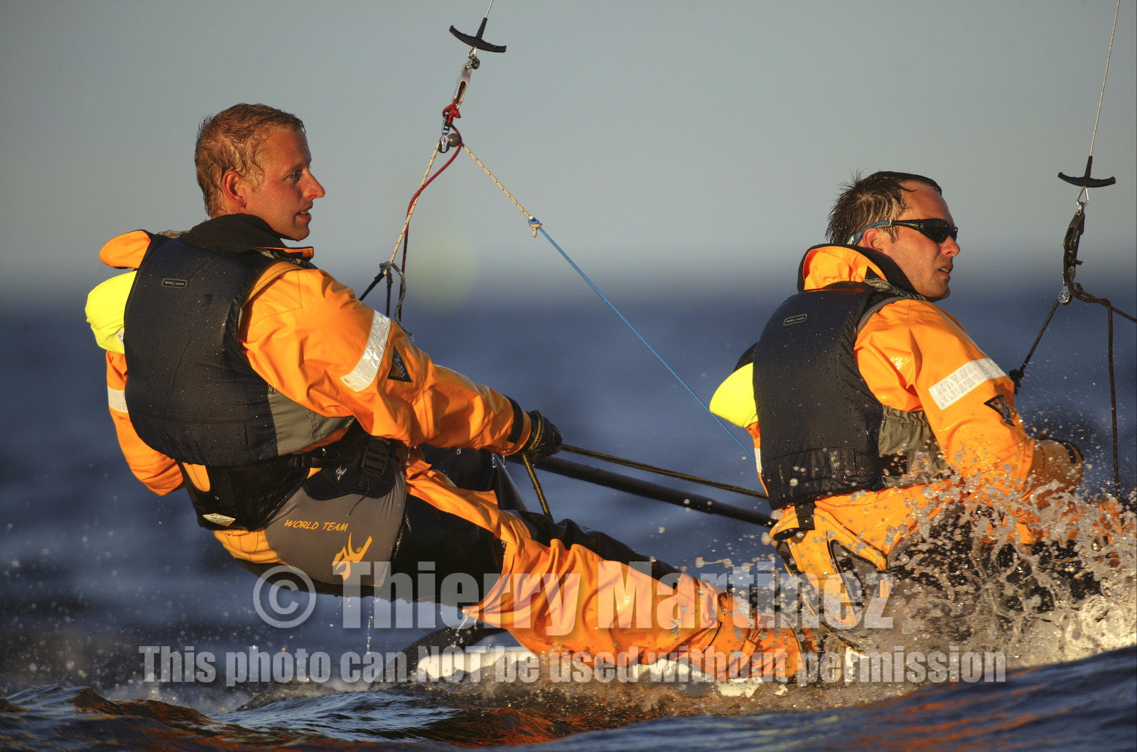 03_3215D  © Th.Martinez,STOCKHOLM - SWEDEN10 07 03-Archipelago Raid (2003). Leg4: Marieham (Finland) TO Fejan (SWE). Team Nokia - Kempff , Magnus Nordstrom looking at the map and Joakim Kempff at the helm.