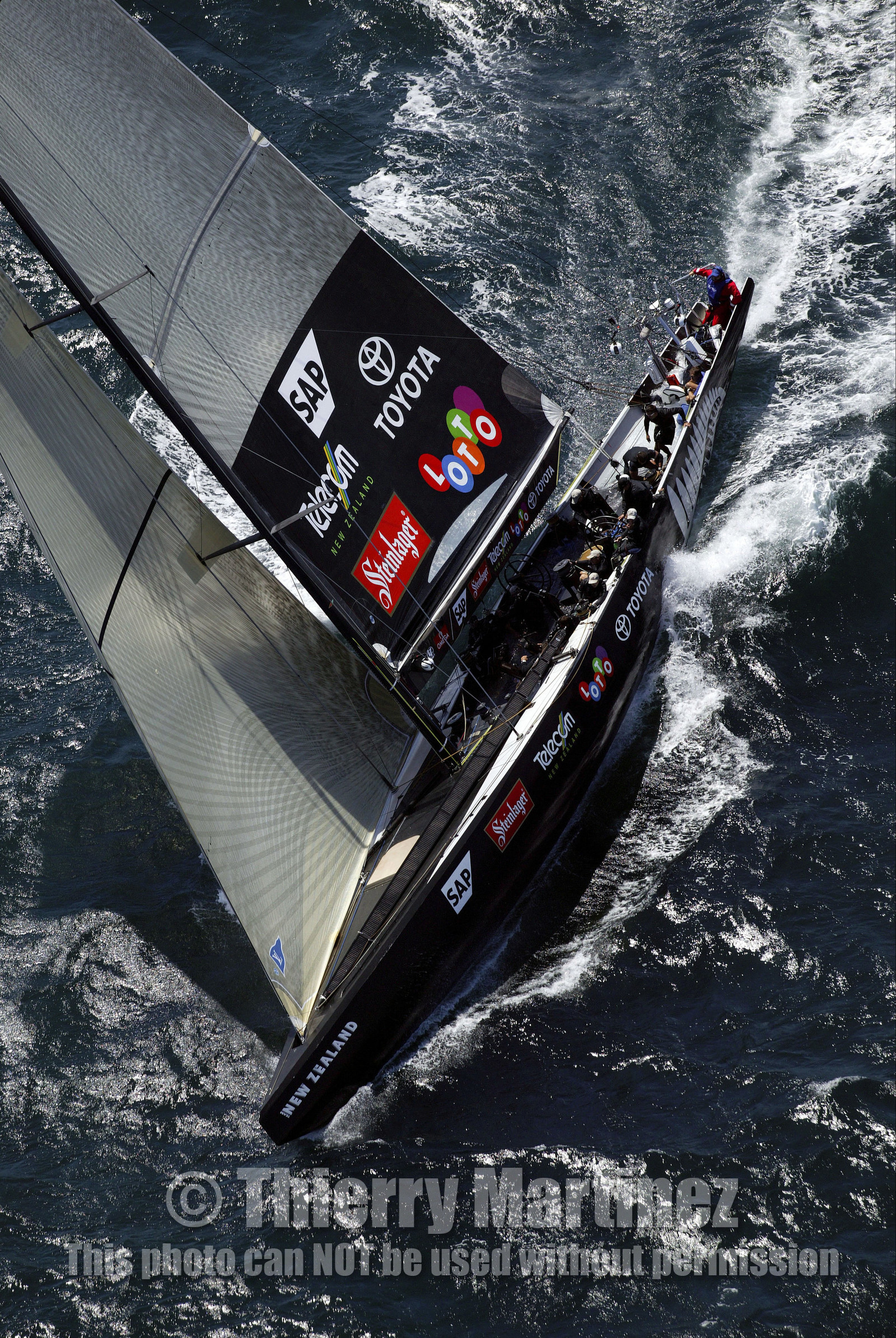 03_0160D ©Th.Martinez - Auckland (NZ) . America's Cup 2003. 15th February 2003. Day 1..Alinghi (SUI 64) vs Team NZ (NZL 82) .NZL 82 in first minutes of Race 1 before retiring on damage. Alinghi 1- Team NZ 0.