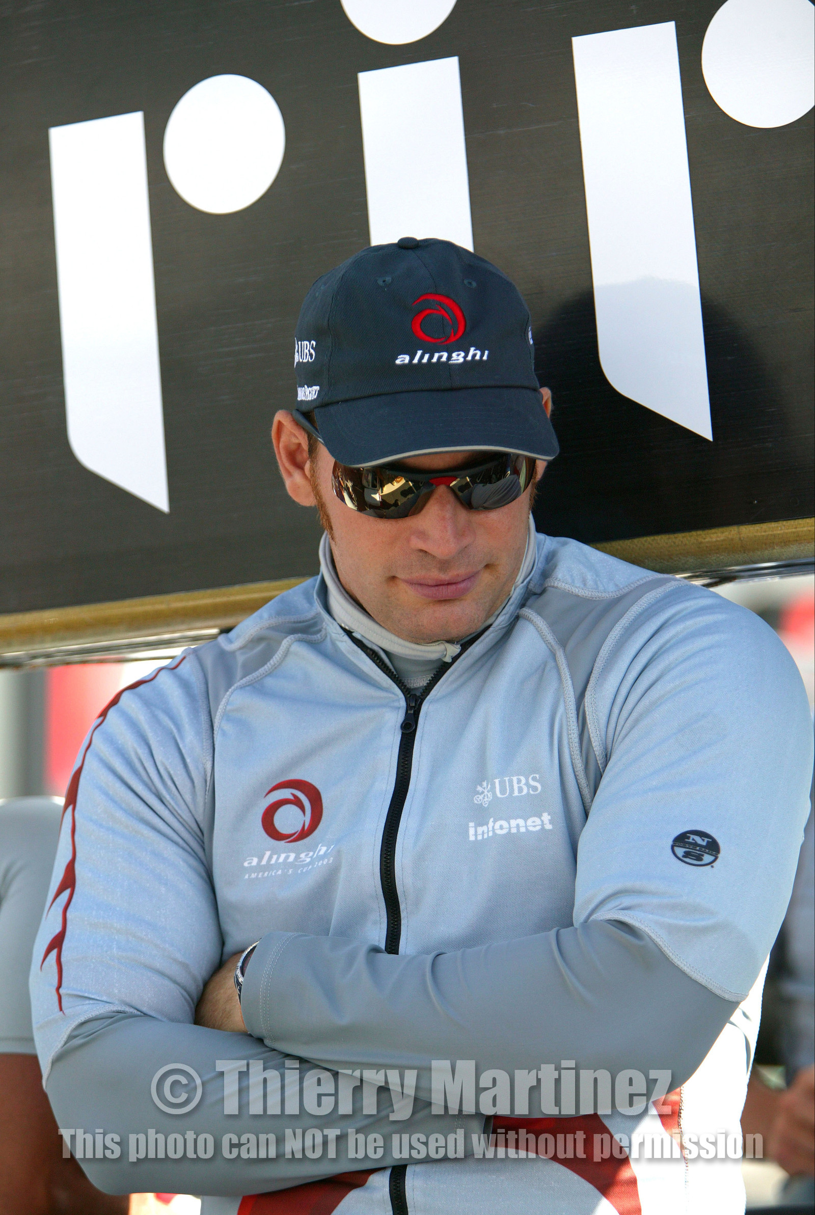 03_0876D © Th.Martinez. Auckland   New Zealand. 15 02 03 America's Cup Day 1.Alinghi (SUI64) vs Team New Zealand (NZL82)Alinghi Team onboard SUI64 leaving the dock for the .first race day of the America's Cup 2003. Alinghi grinder, Dominik Neidhart