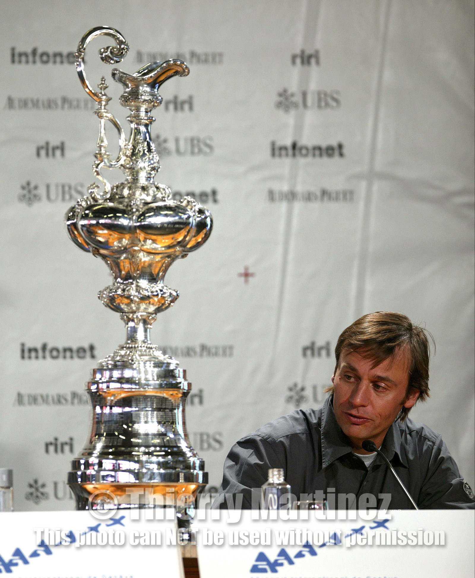 03_2223D ©Th.Martinez Team .Geneva , Switzerland. America's Cup 2003. 8th March 2003.Alinghi Team winner of America's Cup 2003, .Geneva Welcome press conference in Genava Airport. Ernesto Bertarelli (Alinghi's President and navigator) next to Teh America's Cup...