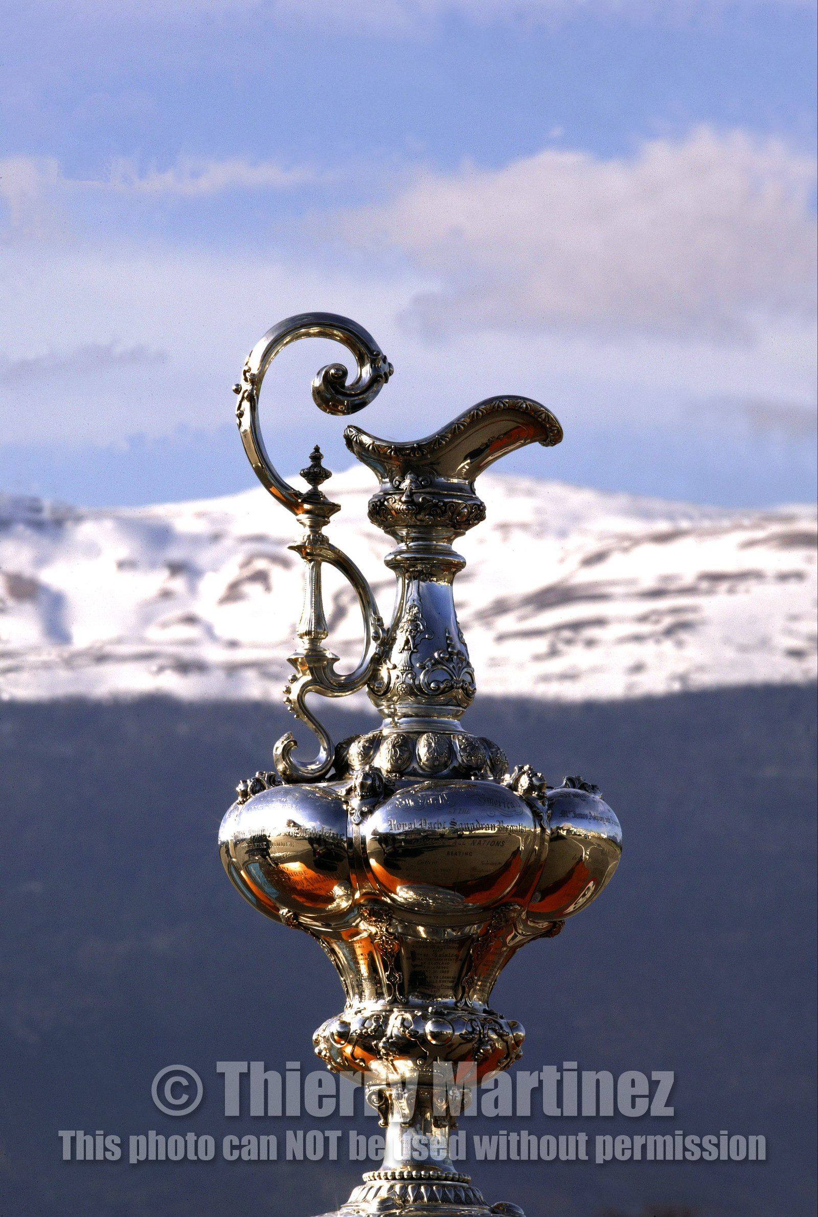 03_2233D ©Th.Martinez .Geneva , Switzerland. America's Cup 2003. 8th March 2003.Alinghi Team winner of America's Cup 2003..The America's Cup with Swiss snow in the background....