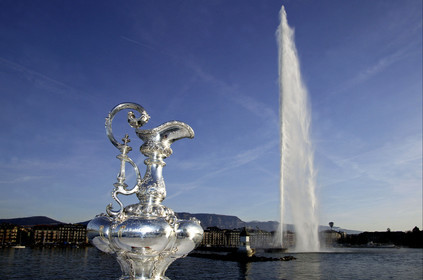 03_2294D ©Th.Martinez. Geneva , Switzerland. America's Cup 2003. 9th March 2003.Alinghi Team winner of America's Cup 2003..The America's Cup on the way to her new home, La Societe Nautique de Geneve (which is Alinghi Yacht Club). Alinghi Team and the CUP did a short trip by the Lac to arrive at La Nautique. On the way stop for a photo The Cup with jet deaude Geneve in the backgroung.