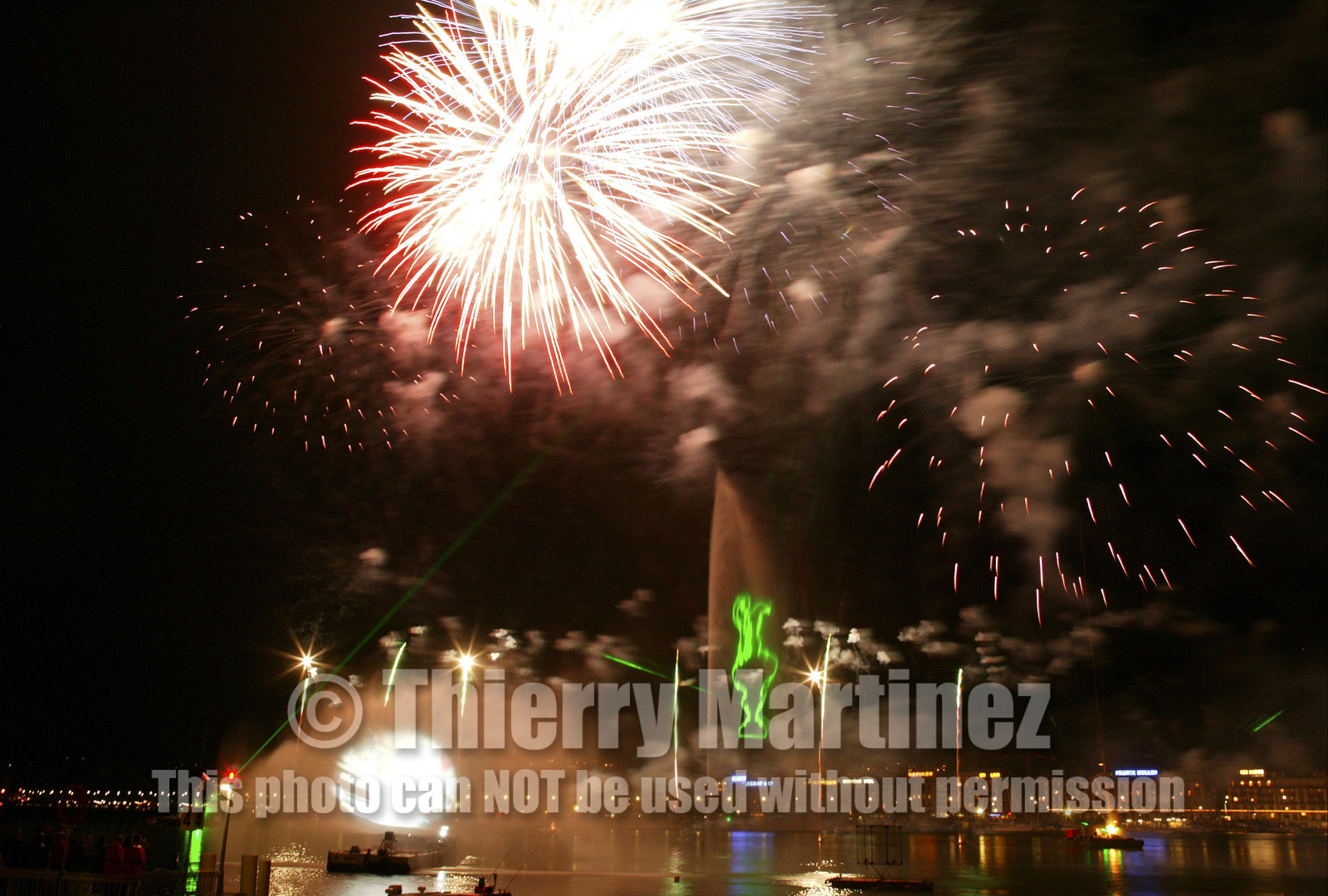 03_2280D ©Th.Martinez. Geneva , Switzerland. America's Cup 2003. 8th March 2003.Alinghi Team winner of America's Cup 2003..Welcome to Alinghi Team in Geneva.Firework and laser show by the lac...